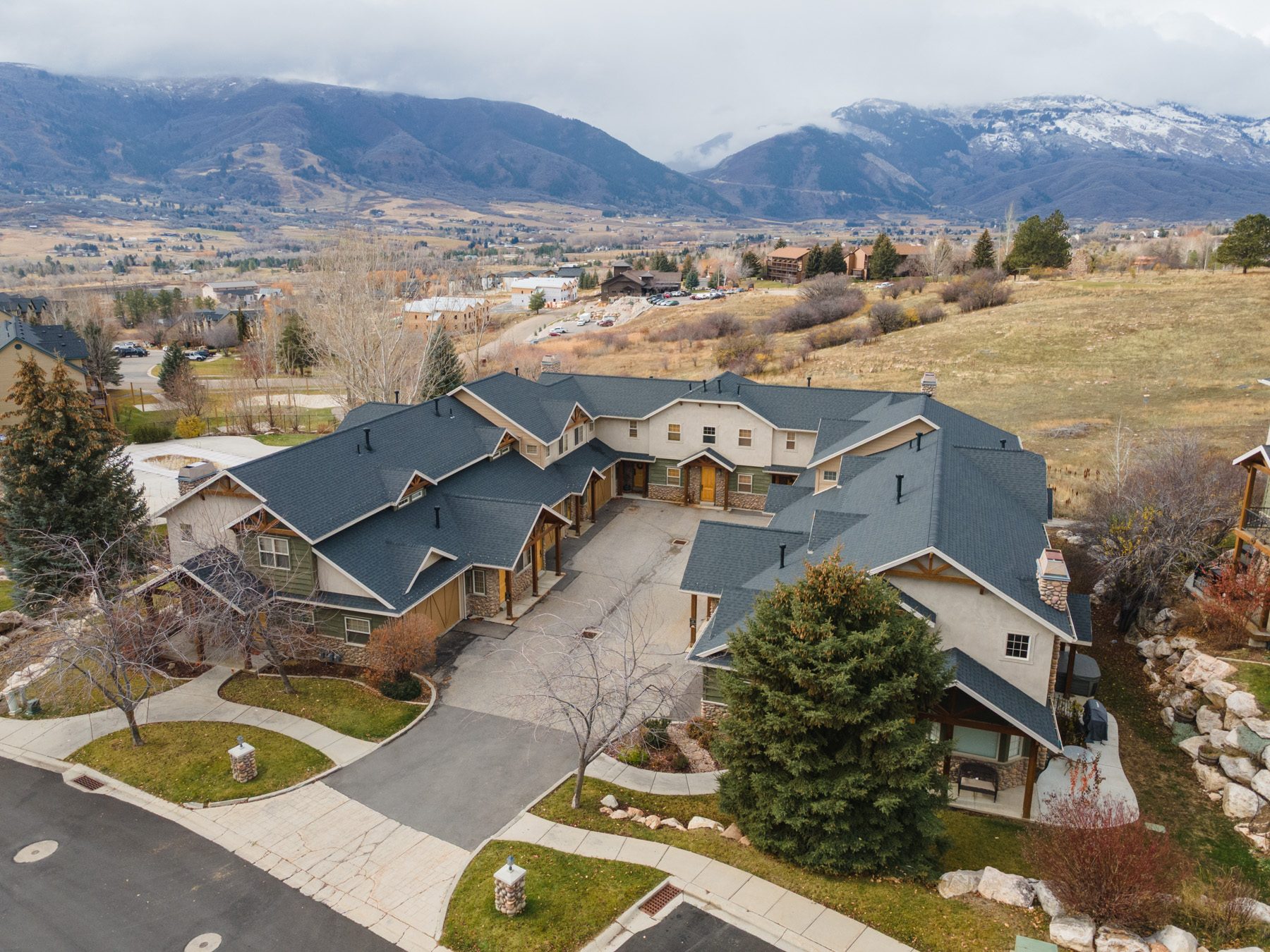 Aerial view of the Cascades townhomes at Moose Hollow with the Wasatch range behind