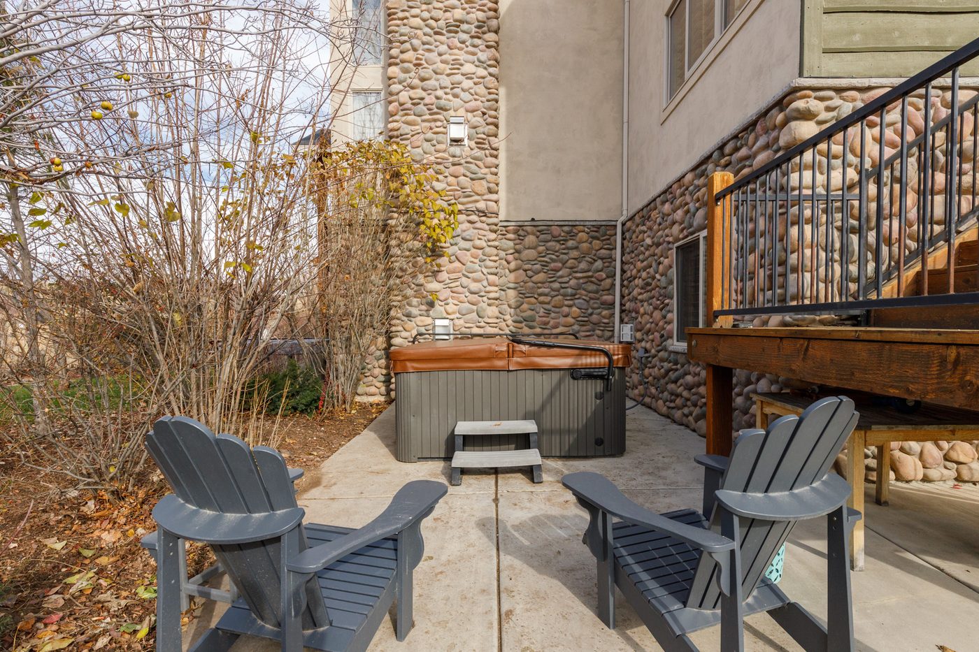 Private hot tub on the patio outside the lower level