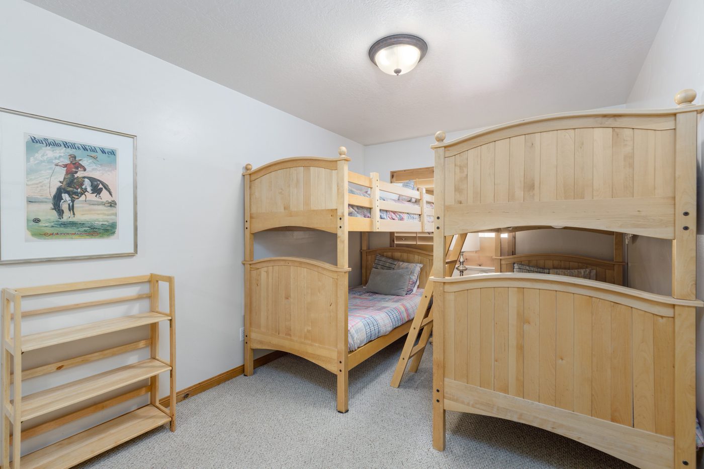 Children's bedroom with two sets of maple bunk beds