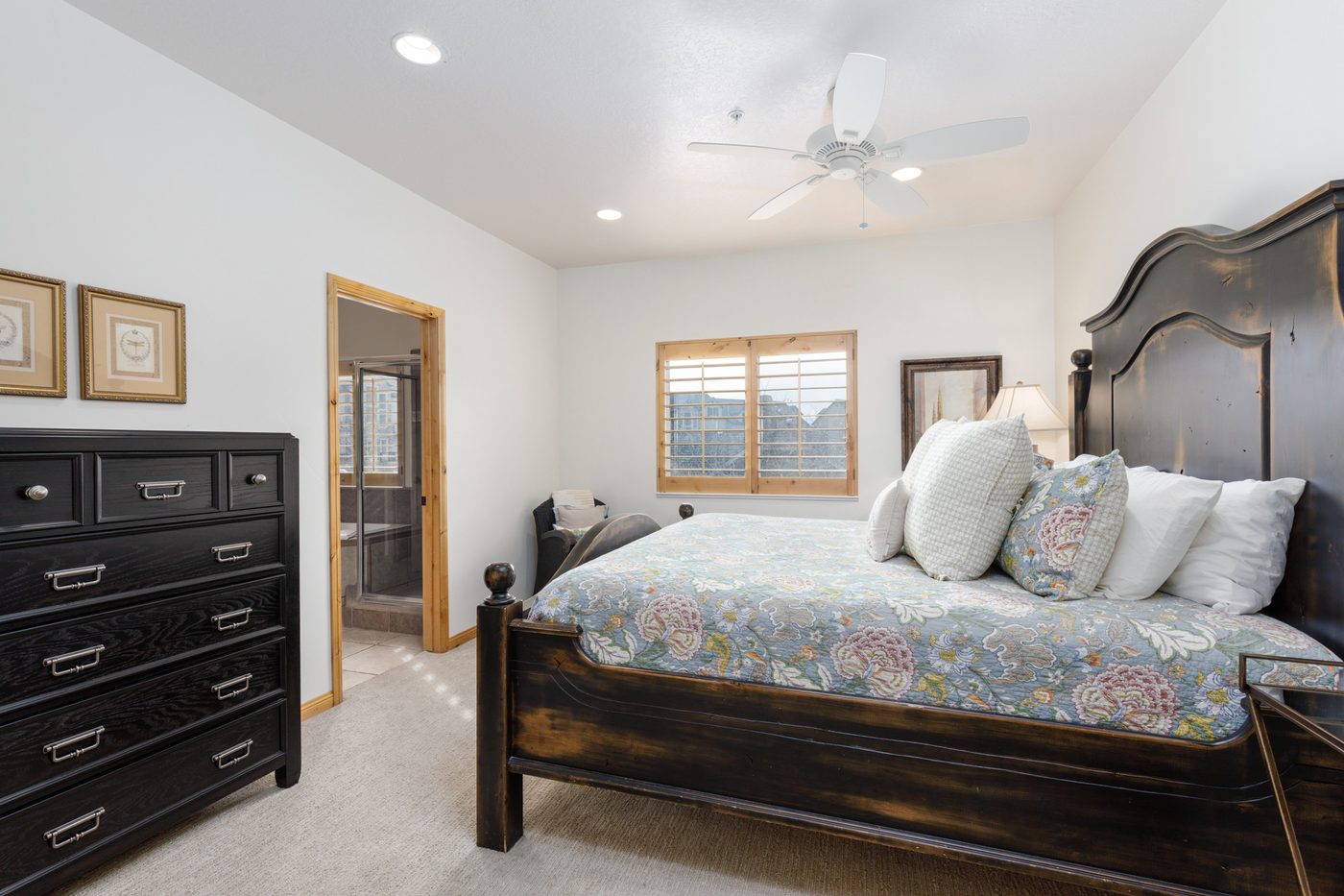 Main-level primary bedroom with a king bed and en suite bathroom