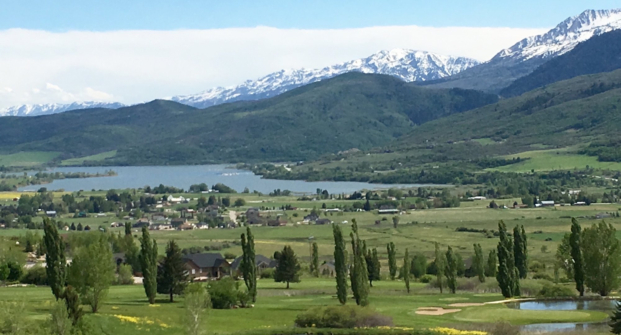Spring in Ogden Valley, the golf course ponds, Pineview Reservoir and Eden below the snow-covered Wasatch
