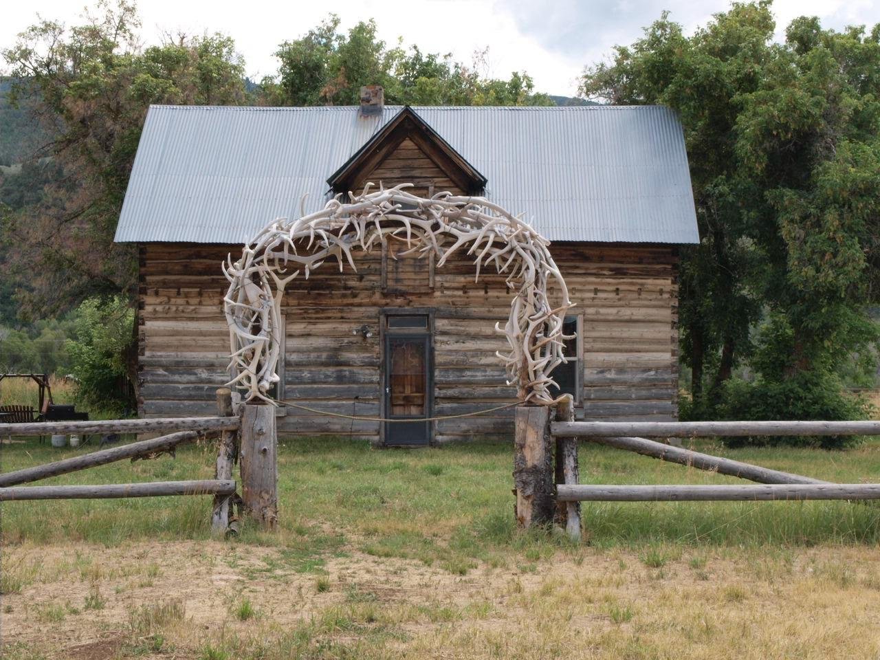 An antler arch over the gate of an old log ranch house near Eden
