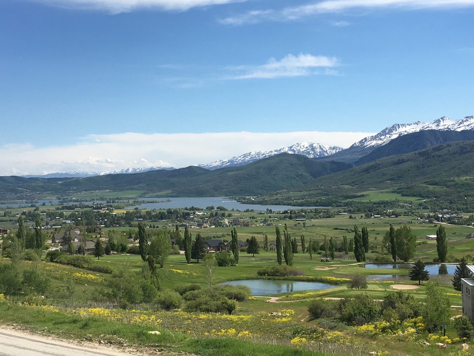 Summer view across the valley to Pineview Reservoir with snow still on the high peaks